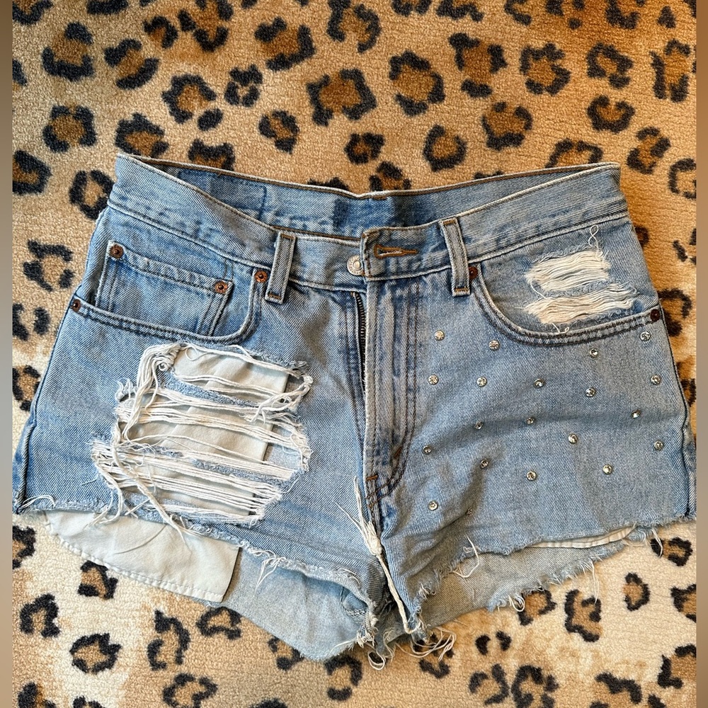 Custom Levi Denim shorts and bezeled rhinestones on left leg!